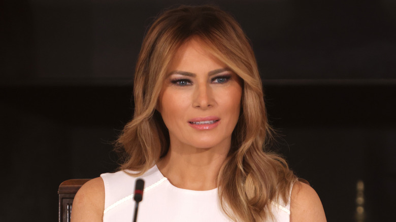 Melania Trump speaking into a microphone