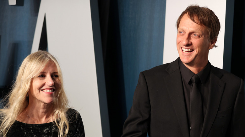 Cathy Goodman and Tony Hawk dressed in black