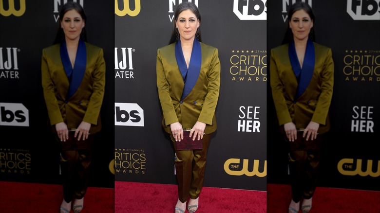 Mayim Bialik wears an olive-green suit