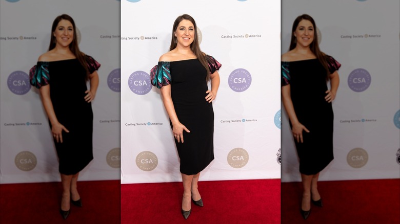 Mayim Bialik in a black dress