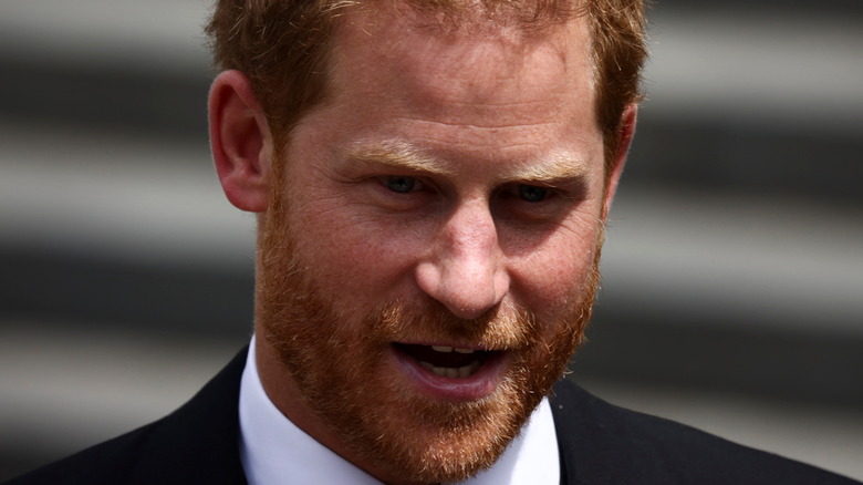 Prince Harry looking down while talking