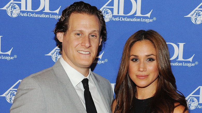 Trevor Engelson and Meghan Markle pose for a photo