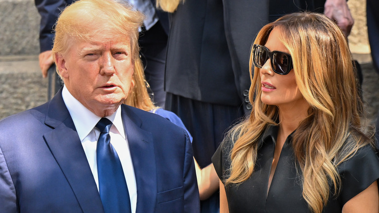 Melania Trump looks over at Donald Trump