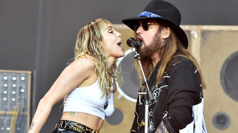 Miley Cyrus and Billy Ray Cyrus singing together
