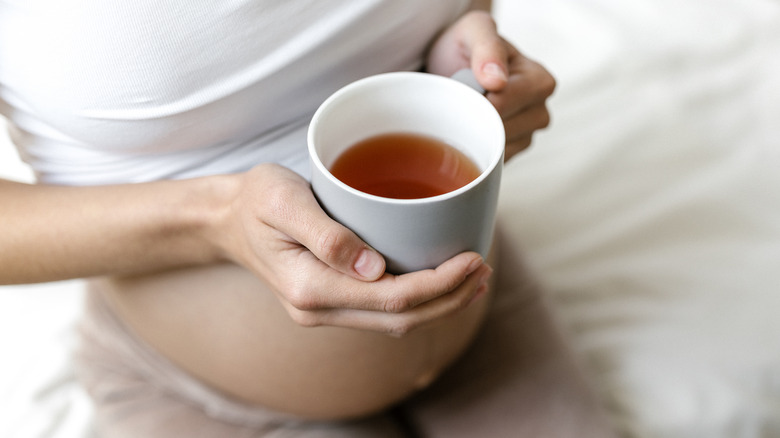 drinking a cup of tea while pregnant