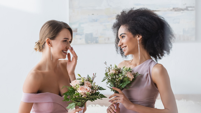 Bridesmaids maid of honor laughing together