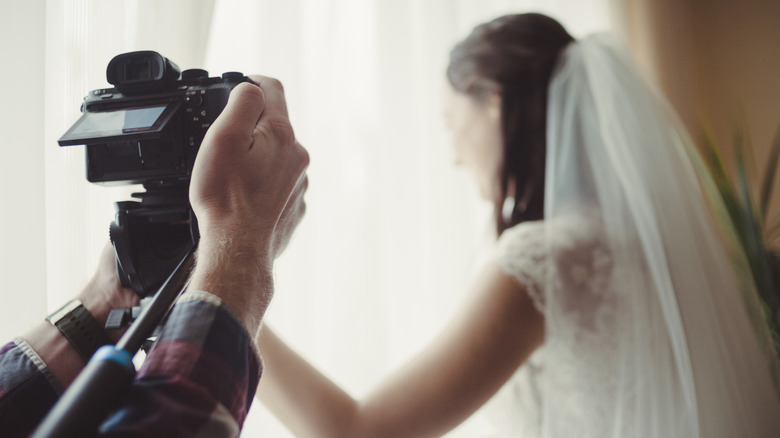 wedding videographer shooting bride