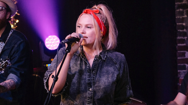 Hailey Whitters performing in denim