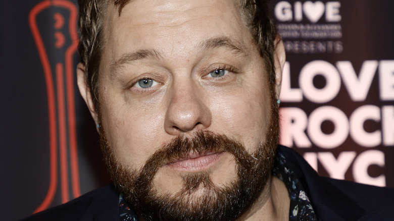 Nathaniel Rateliff posing at event