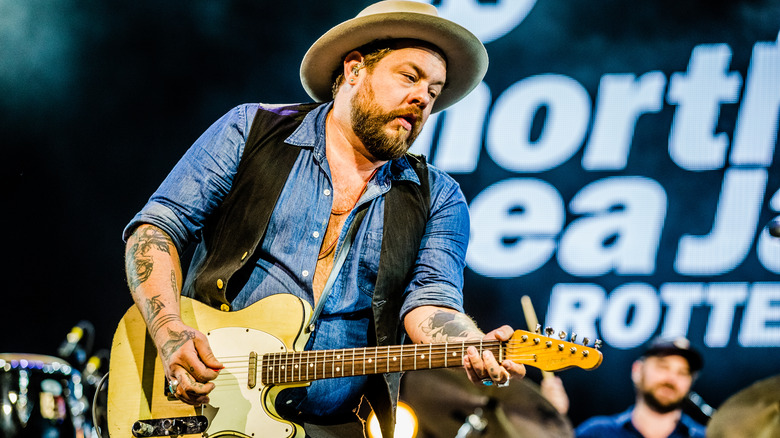 Nathaniel Rateliff playing guitar