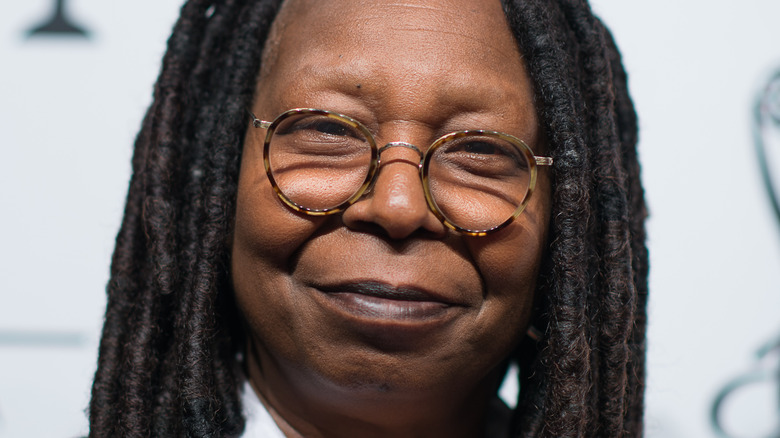 Whoopi Goldberg poses at an event