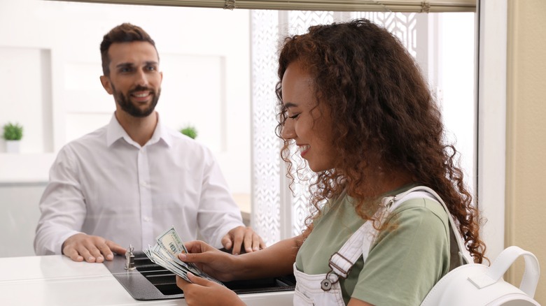 bank teller with customer