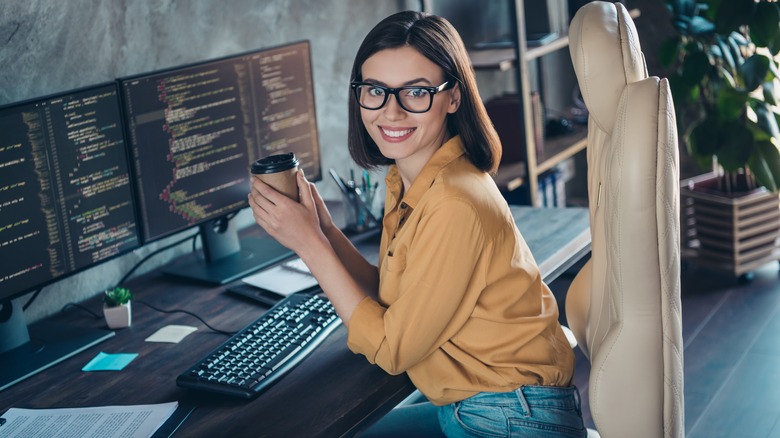 Computer programmer working at her office