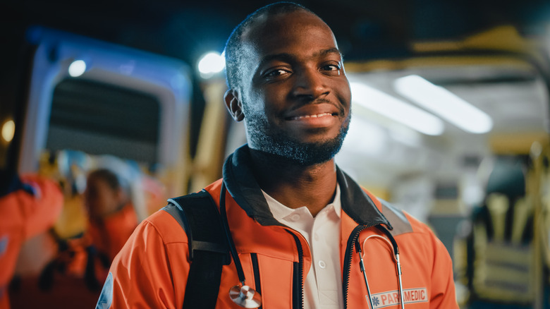 paramedic in front of an ambulance