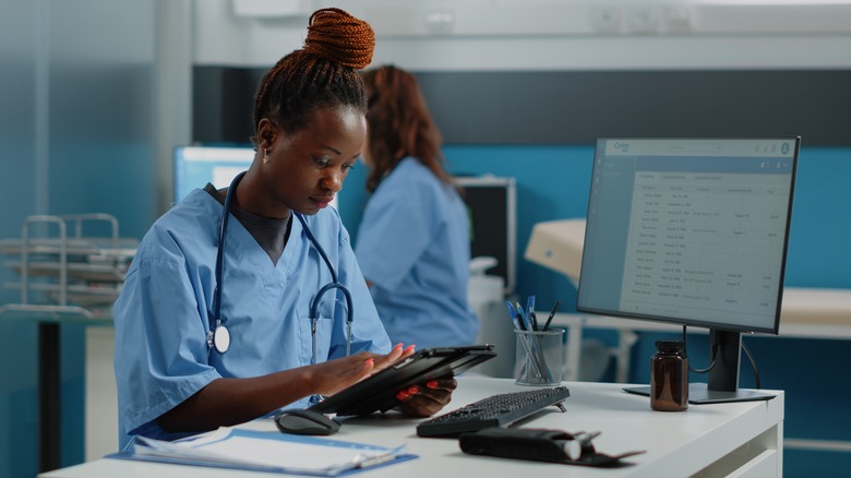 Nurse looking at tablet