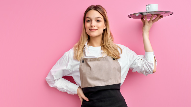 Waitress holding up plate