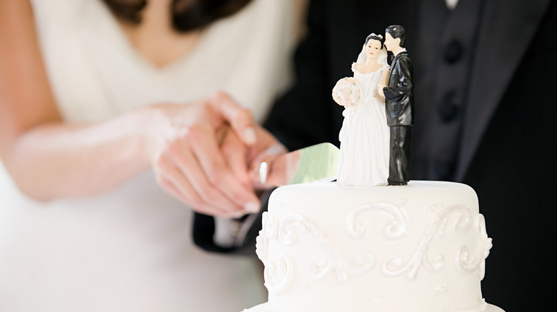 Couple cutting their wedding cake