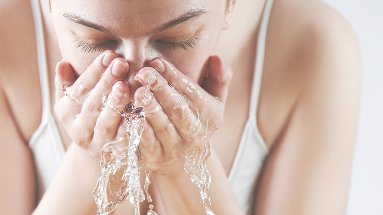 Woman washing face