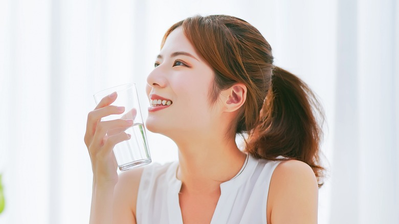 Woman with glass of water