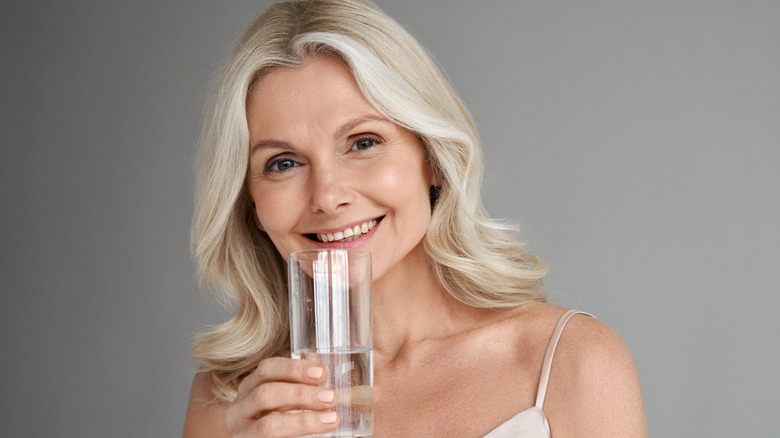 older woman drinking water