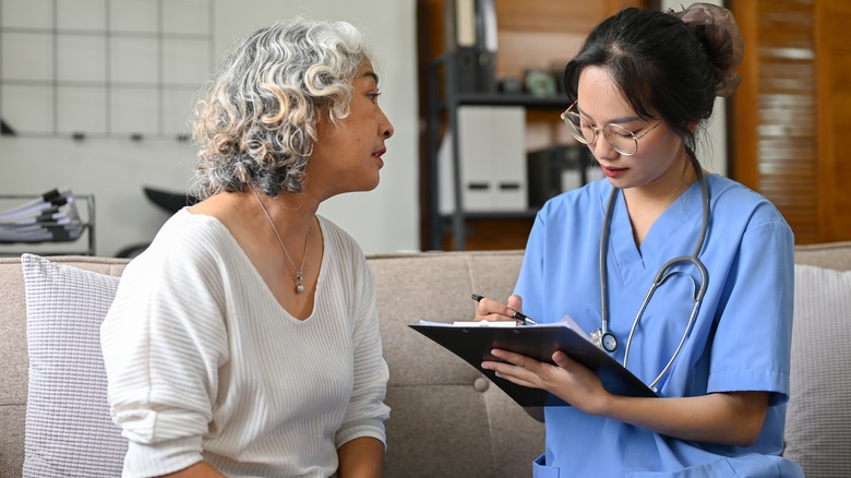 Concerned woman talks to doctor