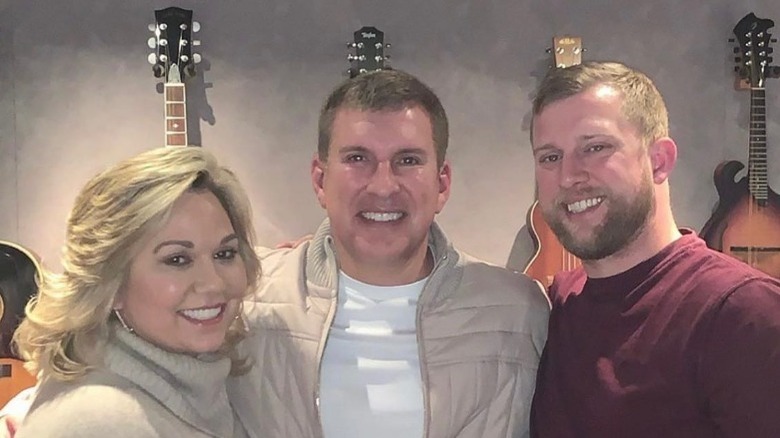 Kyle, Todd, and Julie Chrisley smiling