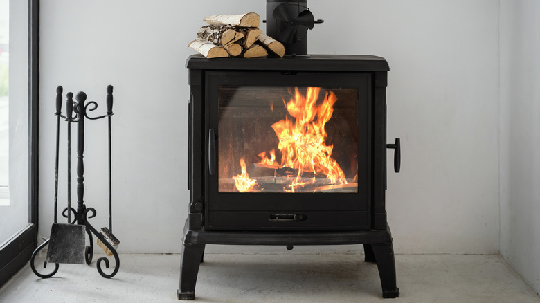 Industrial style indoor fireplace with wood on top
