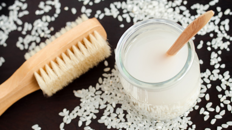 jar, brush, and rice grains