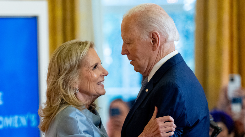U.S. President Joe Biden and first lady Jill Biden embrace during the first White House conference on women's health research in the East Room of the White House on December 11, 2024 in Washington, DC (2024)