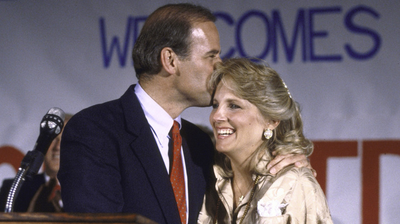 Sen. Joseph R. Biden Jr. kisses his wife Jill's forehead after announcing his bid for 1988 Democratic presidential nomination (1988)