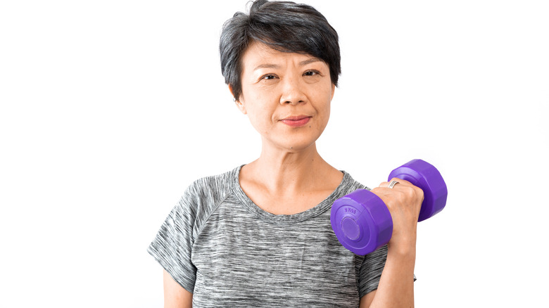 Older woman lifting weights