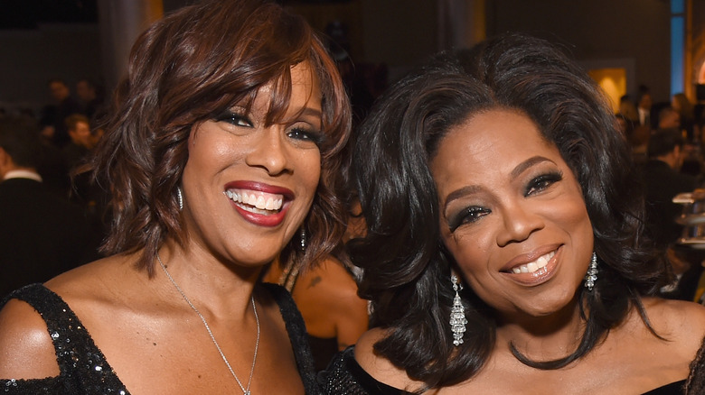 Gayle King and Oprah Winfrey smiling