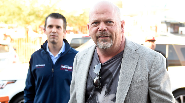 Rick Harrison walks in front of Donald Trump Jr. 