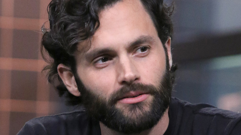 Penn Badgley sitting down