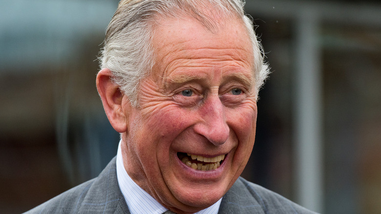 King Charles smiling at an event