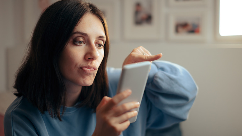 Woman swiping on her phone