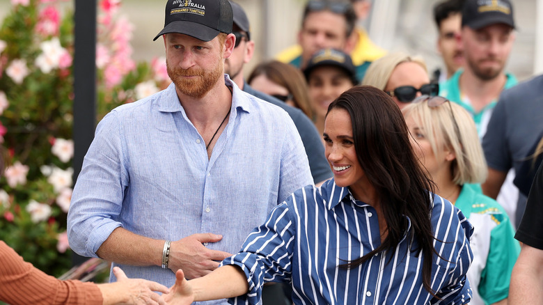 Prince Harry and Meghan Markle greeting members of the public