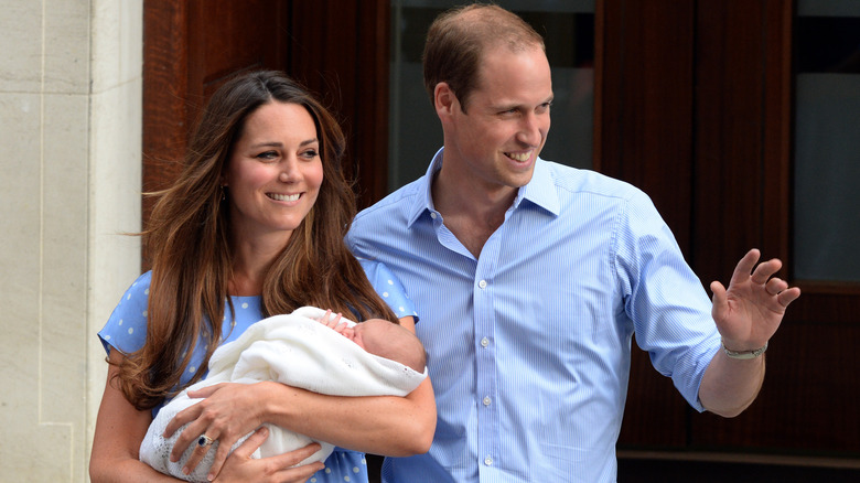 Prince William and Princess Catherine with a newborn Prince George outside hospital