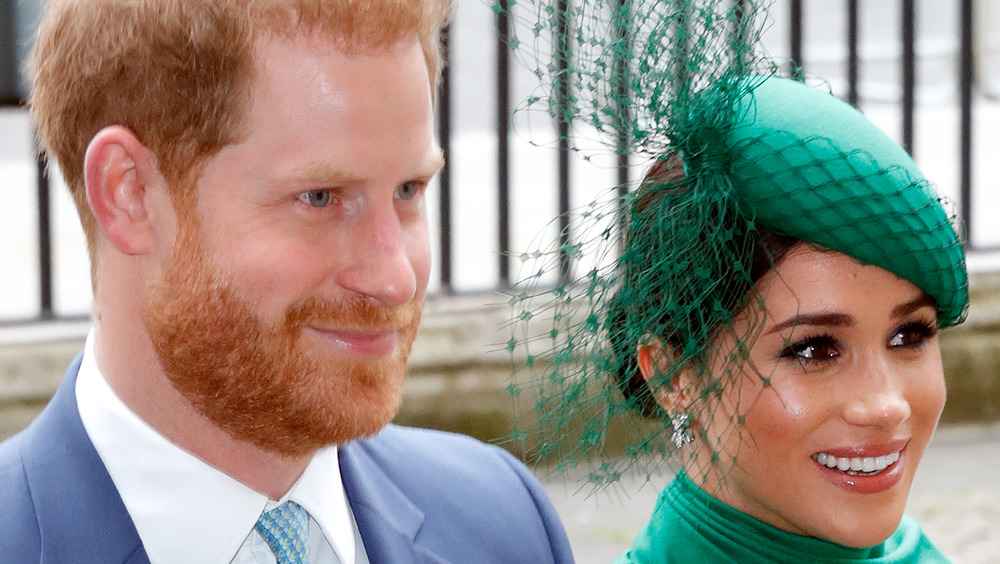 Prince Harry and Meghan Markle walk hand in hand