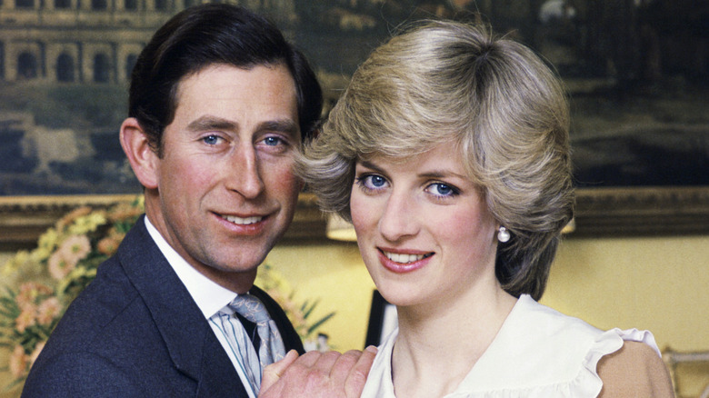 King Charles III with a hand on Princess Diana's shoulder
