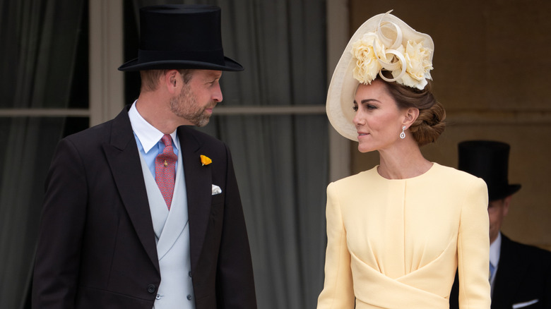 Prince William and Princess Catherine in conversation while attending an event
