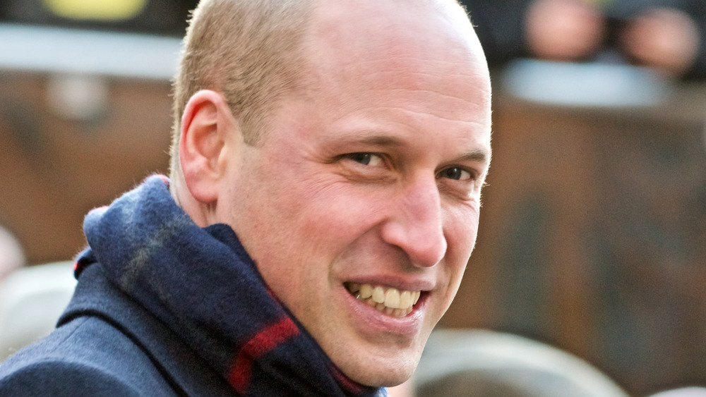 Prince William smiling in scarf