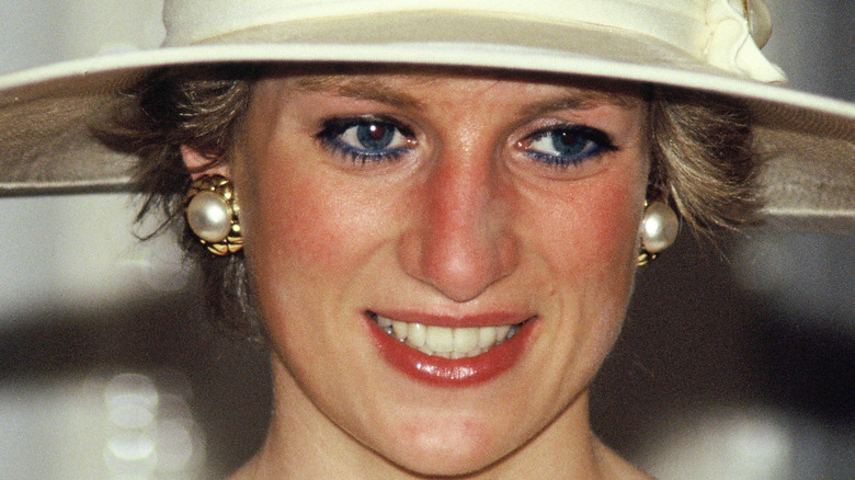 Princess Diana smiling in white