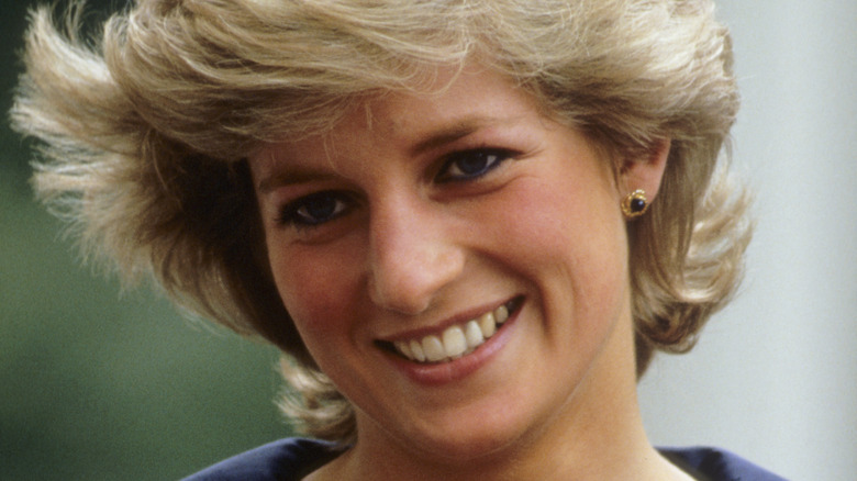 Princess Diana smiles during an event. 