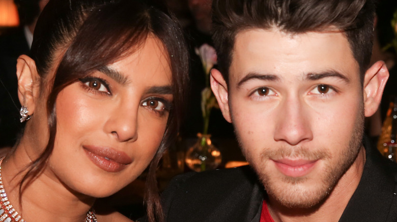 Nick Jonas and Priyanka Chopra pose for a photo. 