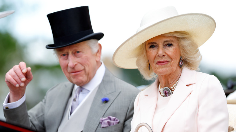 Queen Camilla and King Charles waving