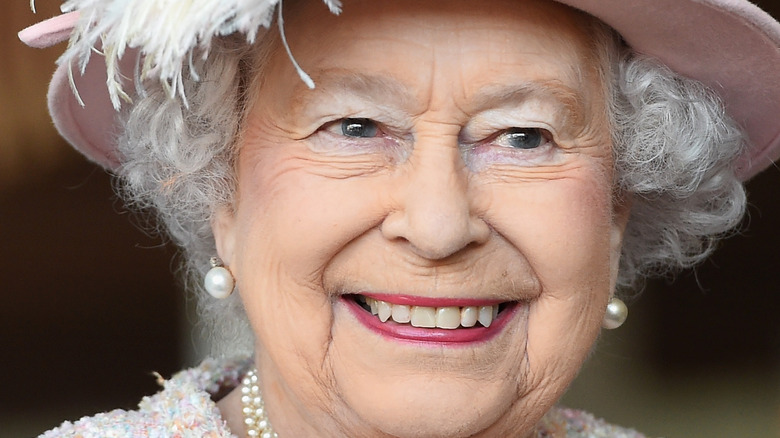 Queen Elizabeth II grinning widely