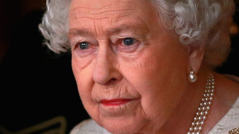 Queen Elizabeth looks away from the camera