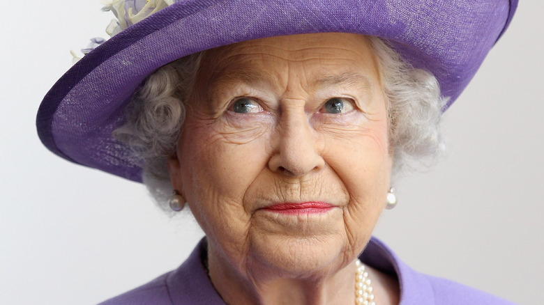 Queen Elizabeth II wearing light purple