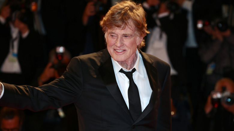 Robert Redford waving at a crowd